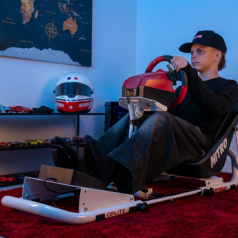NitroKart White V2 racing cockpit in use in a home gaming setup